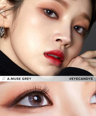 A close-up of a woman’s face with soft eye makeup and red lipstick, showcasing dark eyes wearing Olola Amuse Grey myopia color contacts by Olola. Text: "Olola Amuse Grey" and "#EYECANDYS".