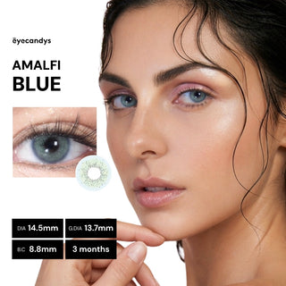 A close-up shows a woman with wet hair wearing EyeCandys Pink Label Amalfi Blue contacts. An inset highlights "AMALFI BLUE" on an eye, lens specs, and a 3-month usage duration.