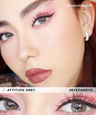 Close-up of a person wearing pink eyeshadow, winged eyeliner, bold mauve lipstick, and EyeCandys Attitude Glitter Grey colored contacts. Text: "EyeCandys Attitude Glitter Grey" and "#EYECANDYS".