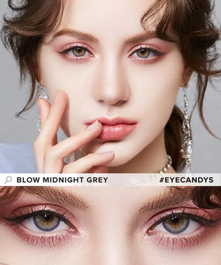 A woman with light skin and dark eyes wears Olola Blow Midnight Grey contacts, pink eyeshadow, and glossy pink lipstick. She gently touches her face. A close-up of her eyes appears below with the text "Olola Blow Midnight Grey #EYECANDYS".