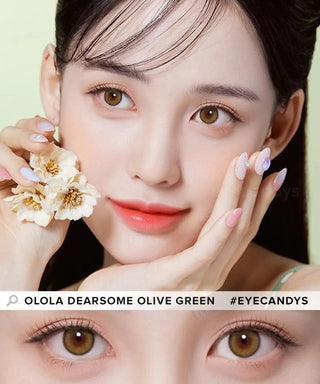 A young woman with clear skin and manicured nails holds yellow flowers near her face. She wears Olola Dearsome Olive Green color contact lenses by Olola, designed for dark eyes, shown in a close-up of her eyes at the bottom.
