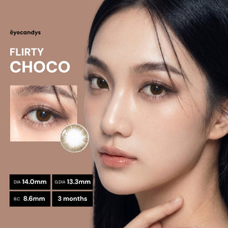 Close-up of a woman with flawless skin wearing EyeCandys Pink Label Flirty Choco lenses. Text shows: DIA 14.0mm, G.DIA 13.3mm, B.C. 8.6mm, 3 months—natural-looking color contacts for daily wear.