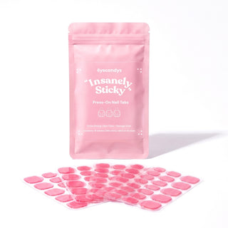 EyeCandys Insanely Sticky Tabs for press on nails with durable adhesive, reusable wear, and salon quality nail application.