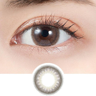 A close-up of a brown eye with long lashes wearing Molak Dark Peony (10pk) circle lenses by Molak. Below, a detailed view shows the daily lens’ brown ring and transparent center for a natural look.