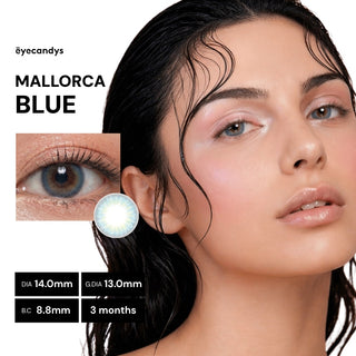 A woman with dewy makeup wears EyeCandys Pink Label Mallorca Blue contact lenses. The close-up and product image highlight their natural blue color, promising comfort and up to 3 months of use.