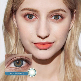 A woman with long blonde hair and light skin wears NEO Vision Cosmo Blue circle lenses. A close-up inset highlights the lens, labeled "NEO Vision Cosmo Blue." She has natural makeup with coral lipstick.