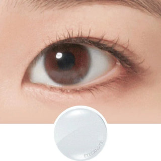 A close-up of a natural brown eye above an image of a single NEO Vision Neoism Super Clear (50pk) contact lens by NEO Vision on a white background.