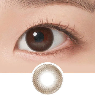 A close-up of a brown eye with natural makeup, long lashes, and a defined brow. Below is the NEO Vision Neoism Coco Brown (50pk) by NEO Vision—stylish prescription colored contacts featuring a coco brown shade and transparent center.
