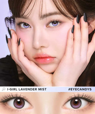 A woman with long, black matte nails rests her face in her hands, showing off her i-Girl One Pick Balance Lavender Mist Purple contacts and glossy lips. A close-up below highlights the natural blending lenses from i-Girl.