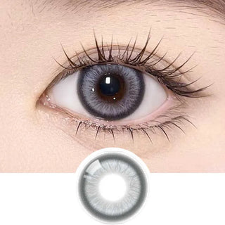 Close-up of a human eye wearing Olola Meow Vivid Burman Grey color contacts by Olola, with long eyelashes visible. A separate image below shows the unique grey pattern and shade designed for dark eyes.