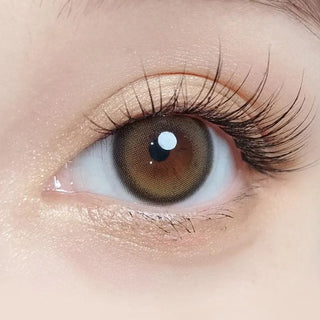 Macro shot of an eye wearing the Olola Blurring Brown prescription colour contact lens, showing the multi-colored detail and natural effect on dark brown eyes.