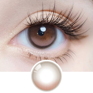 Close-up of an eye with long lashes wearing Olola Vela Brown prescription colored contact lens, showing the lens design below.