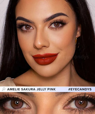 A woman with bold makeup, wearing red lipstick, long lashes, and brown-pink prescription colored contacts. A close-up highlights her eyes wearing EyeCandys Limited Edition Amelie Sakura Jelly Pink (1 PAIR), a Solotica Hidrocor dupe.