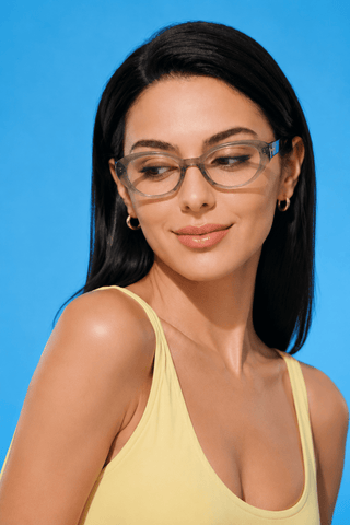 EyeCandys Bardot Cat Eye Matcha clear frame glasses model shot featuring transparent matcha green cat-eye frames with non-prescription clear lenses, trendy women's fashion eyewear for everyday wear, office style, blue light fashion frames, and modern minimalist looks.