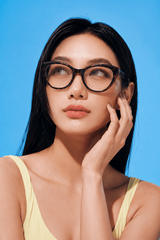 EyeCandys Bardot Cat Eye Tortoiseshell clear frame glasses model shot featuring transparent tortoiseshell cat-eye frames with non-prescription clear lenses, trendy women's fashion eyewear for everyday wear, office style, blue light fashion frames, and timeless chic looks.