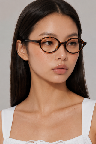 EyeCandys Cassian clear lens glasses model shot featuring stylish designer-inspired optical frames with non-prescription clear lenses, trendy women's fashion eyewear, blue light style glasses for everyday wear, office outfits, minimalist fashion, and modern luxury looks.