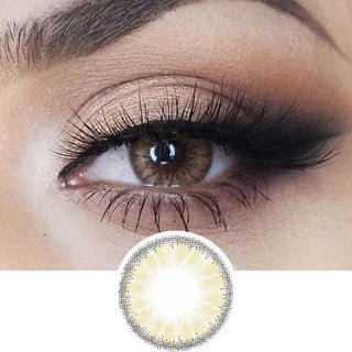 Macro shot of an eye wearing the desire toffee brown colour contact lens, showing the light color detail and natural effect on dark brown eyes, with smokey eye makeup, with a cutout detail of the same lens below