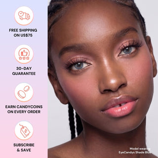 A woman with braided hair wears EyeCandys Shade Blue high-coverage contacts and pink makeup. Beside her, icons highlight: free shipping over $75, 30-day guarantee, CandyCoins rewards, and subscribe & save.