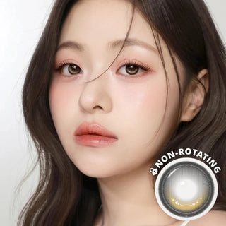 Model wearing i-Girl One Pick Dear One Honey contact lenses from EyeCandys, featuring warm honey-brown color, weighted non-rotating design, subtle eye-widening effect, and all-day comfort with silicone hydrogel