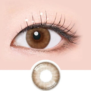 Macro shot of an eye wearing the i-Sha Serenity 1-Day Brown (10pk) prescription colour contact lens, showing the multi-colored detail and natural effect on dark brown eyes, with clean eye makeup. At the bottom is the pattern of the colored lens design, showing the dotted detail and pigmentation.