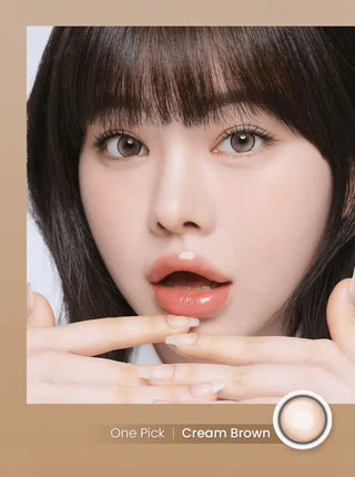 Girl with warm, glowing eyes wearing Eyecandys Onepick Cream Brown colored contact lenses – natural and stylish prescription colored contact lenses for a soft, creamy look