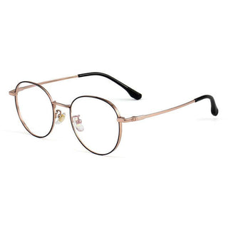 The EyeCandys Luna Round features gold metal round frames with black-tipped arms. These vintage-style titanium glasses evoke classic dark academia elegance, shown on a white background.