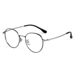 The EyeCandys Luna Round eyeglasses feature thin silver rims, adjustable nose pads, and black plastic-coated temple tips for a classic dark academia look, showcased against a white background.