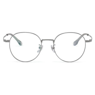 The EyeCandys Luna Round features vintage-style titanium eyeglass frames with clear lenses and adjustable nose pads, shown facing forward against a white background.