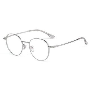 EyeCandys Luna Round eyeglass frames feature vintage-style titanium construction, clear nose pads, and temple tips, presented against a white background.