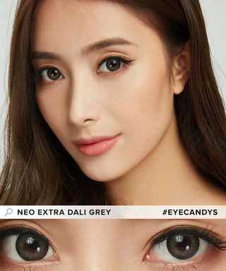 A woman with long brown hair wears natural makeup and grey circle lenses. The close-up highlights her eyes with NEO Vision Extra Dali Grey by NEO Vision. Text reads: "#EYECANDYS".
