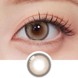 A close-up of an eye wearing Olola Glint 1-Day Brown (10pk) by Olola, with a separate image below showing the lens design. These brown daily circle lenses enlarge the iris and provide a bright, defined appearance.