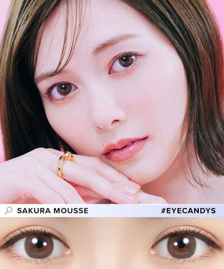 A close-up of a woman with smooth light skin and straight brown hair wearing natural makeup and Feliamo 1-Day Sakura Mousse (10pk) color contact lenses. Below, a close-up highlights her brown eyes. Text: “Feliamo” and “Sakura Mousse.”.