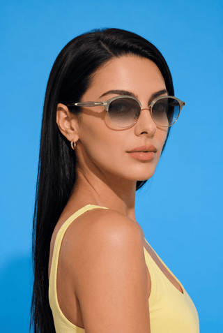 EyeCandys Santorini Round sunglasses model shot featuring trendy round sunglasses with UV protection, stylish women's fashion eyewear, designer-inspired shades for everyday wear, summer outfits, beach vacations, travel, street style, and modern luxury fashion.