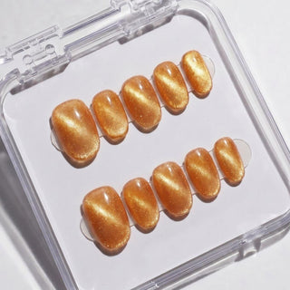 EyeCandys Sun Drops Press-On Nails featuring burnished copper chrome shimmer nails, short round shape, reusable salon gel finish.