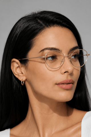 EyeCandys Zephyr Slim Oval clear lens glasses model shot featuring slim oval optical frames with non-prescription clear lenses, prescription-ready women's eyewear, trendy fashion glasses, blue light style frames for everyday wear, office outfits, minimalist fashion, and modern luxury looks.