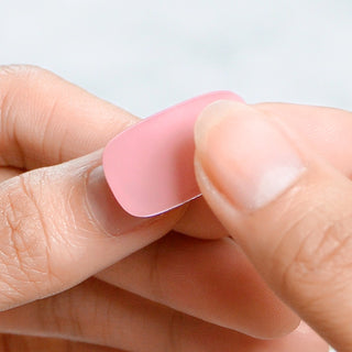 Applying EyeCandys Gel Nail Sticker on nails for a professional-looking, gel-like finish with long-lasting wear