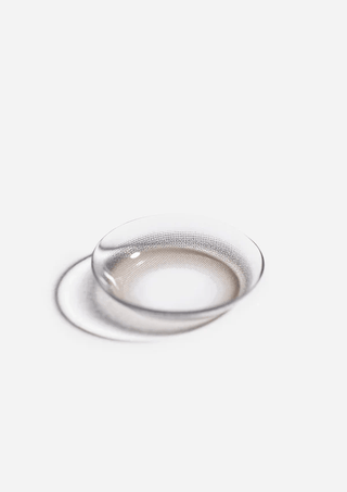 Macro photo of the Eyecandys Aery Rose Lucid Grey prescription colour contact lens, showcasing the thin material and cosmetic lens design.