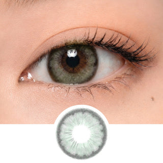 A close-up of a human eye wearing EyeCandys Pink Label Angel Green contacts with a natural finish, fair skin, and subtle makeup. Below the eye is a circular image displaying the design of these colored lenses.