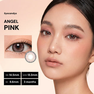 A woman with smooth skin and natural makeup wears light pink lipstick while modeling EyeCandys Pink Label Angel Pink color contact lenses, shown in a close-up inset. Text highlights product specs and the name “Pink Label Angel Pink.”.