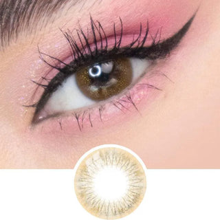 A close-up of an eye with winged eyeliner and pink eyeshadow wearing EyeCandys Attitude Glitter Brown color contact lenses. Below, a separate image displays the natural brown design by EyeCandys.