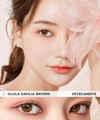 A woman with soft makeup and Olola Dahlia Brown contact lenses poses with a large pale pink flower covering one eye. A close-up shows her brown eyes. Text: “Olola Dahlia Brown by Olola #eyecandys.”.