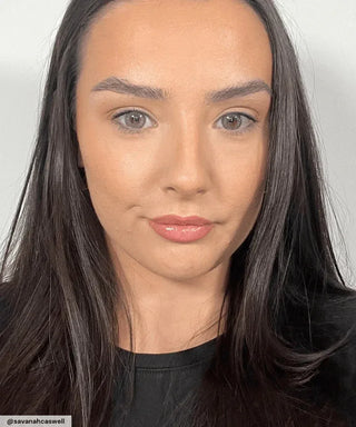 Model wearing Desire Green prescription circle contact lenses on naturally brown eyes
