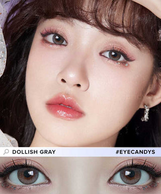 Close-up of glossy pink lips, shimmering eyeshadow, and Molak 1-Day Dollish Grey (10pk) lenses by Molak. The focus is on their eyes and makeup, with an inset of both eyes. Text: "Dollish Gray" and "#EYECANDYS".
