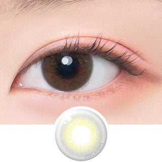 Macro shot of an eye wearing the DooNoon Ppeum 1-Day Grey (10pk) prescription colour contact lens, showing the multi-colored detail and natural effect on dark brown eyes, with clean eye makeup. At the bottom is the pattern of the colored lens design, showing the dotted detail and pigmentation.