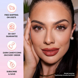 Close-up of a woman wearing EyeCandys Amelie Earl Grey lenses by EyeCandys—enhancing her look with flawless makeup, bold brows, long lashes, and matte lips. Left side shows icons for free shipping, 30-day guarantee, rewards, and subscriptions.