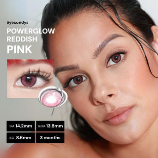 A woman with smooth skin wears vibrant EyeCandys Powerglow Reddish Pink color contacts. Close-up reveals: DIA 14.2mm, G.DIA 13.8mm, B.C 8.6mm, UV protection, lasts 3 months. Text: "EyeCandys Powerglow Reddish Pink".