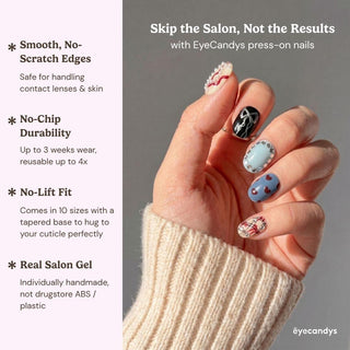 A hand in a long sleeve sweater displays EyeCandys Heartbreak Hotel Press-On Nails in pastel and patterns. Benefits: smooth edges, chip-free durability, secure fit, real salon gel look, and reusable up to 4x for long-lasting style.