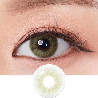 A close-up of a person's dark eyes wearing Olola Heiress Olive contact lenses by Olola. Below, the green lens is shown separately to highlight its color and design. The natural eye makeup features subtle eyeliner and mascara.