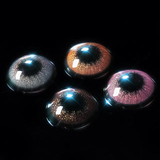 The EyeCandys Attitude Glitter Set (For Party Looks) by EyeCandys features gray, brown, blue, and purple lenses illuminated on a black background, each lens reflecting light and displaying detailed iris patterns for a natural look.