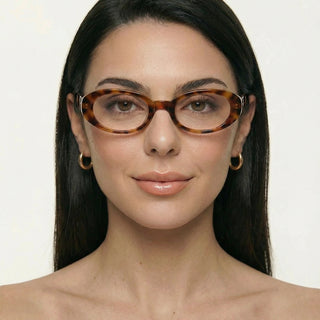 Eyecandys Tortoiseshell Jellicle Oval prescription reading glasses on model, featuring photochromic lenses, trendy full frame eyewear.